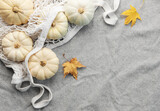 Top view autumn composition with pumpkins in mesh shopping bag