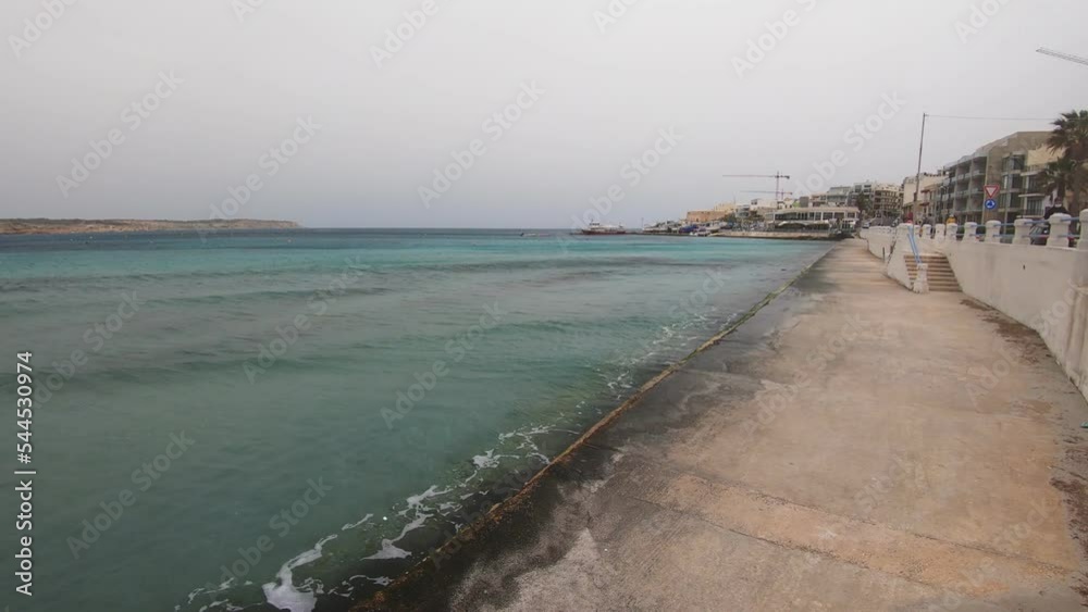 The Popular Tourist Resort of Mellieha in Malta on a Windy Day. Timelapse Footage The Popular Tourist Resort of Mellieha in Malta on a Windy Day. Timelapse Footage