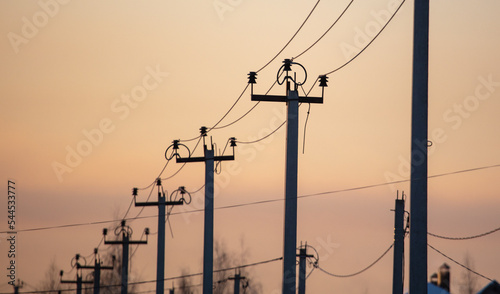 Electric pole on the background of the sunset. Technology