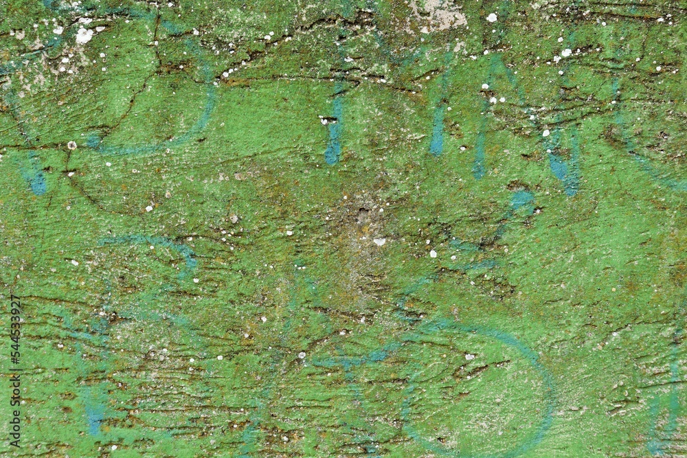 Background, texture of a concrete wall with remnants of green paint