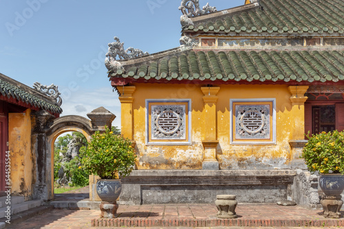 Colorful yellow stone building traditional architecture of the Hue Historic Citadel complex in Hue Vietnam
