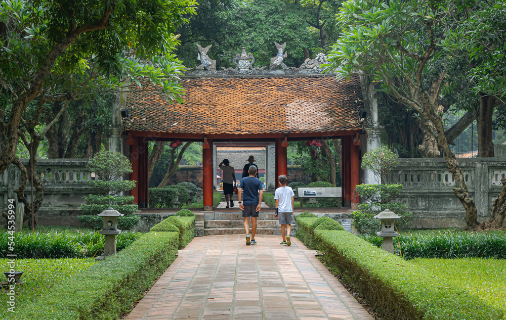 Colorful traditional gate structure at the gardens of the Temple Of Literature in Hanoi Vietnam