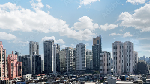 Aerial view of skyscrapers and buildings in skyline  day light Camera moving around buildings 3d rendering