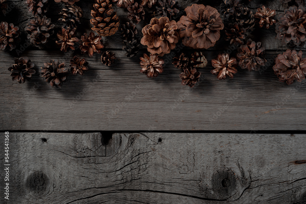 Christmas Pine Cone on Wooden Rustic Background. Christmas Eve and New Year Thematic Mockup Wallpaper for Clipart.
