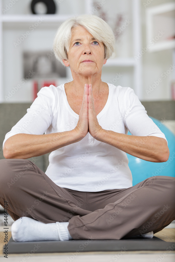a senior woman doing yoga a senior woman doing yoga