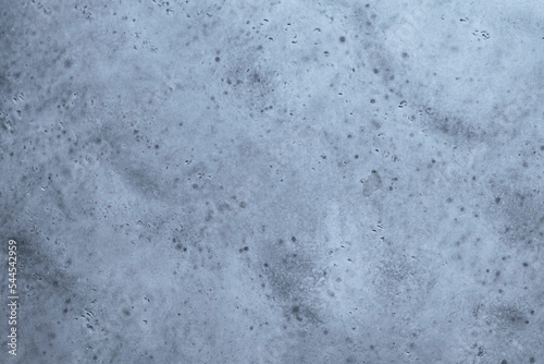 Gray textured cement wall background with fine concrete chips. Construction backgrounds.