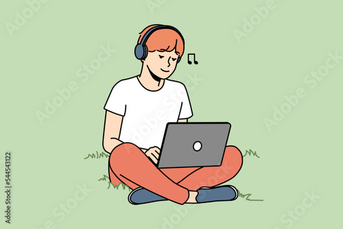 Guy sitting on grass outdoors working on laptop wearing earphones. Happy man relax outside with computer listen to music in headphones. Vector illustration. 