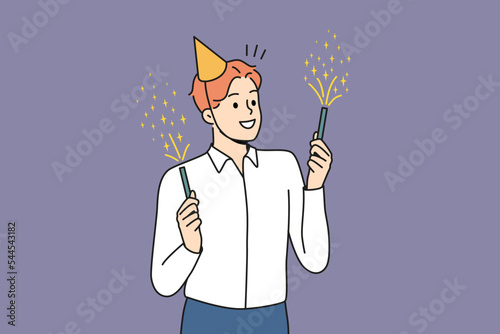 Smiling young man in birthday hat holding sparklers celebrating. Happy businessman have fun enjoy fireworks at party. Vector illustration. 