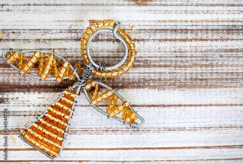 Bilde på lerret Rustic wooden flat lay, Christmas background with African beaded Christmas ornam