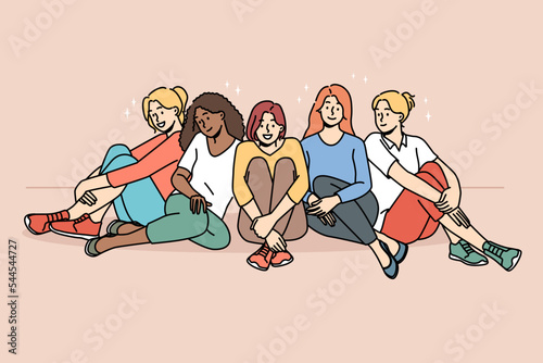 Smiling multiracial diverse women sit together show unity and support. Happy multiethnic interracial girls have fun relax. Togetherness and friendship. Vector illustration. 