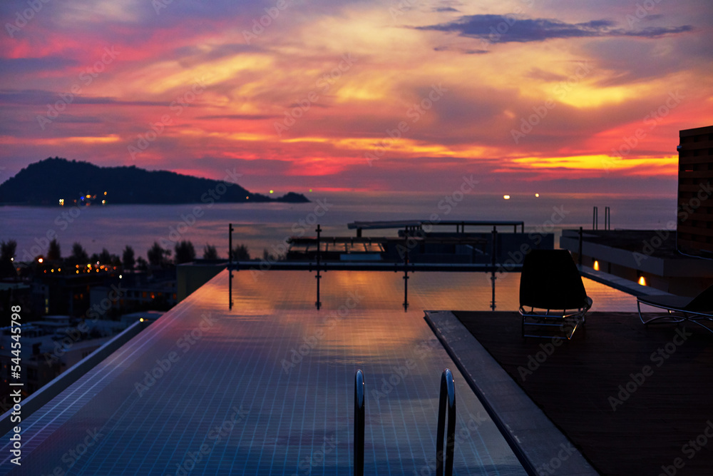 Luxurious rooftop pool at sunset. Swimming pool, vacation