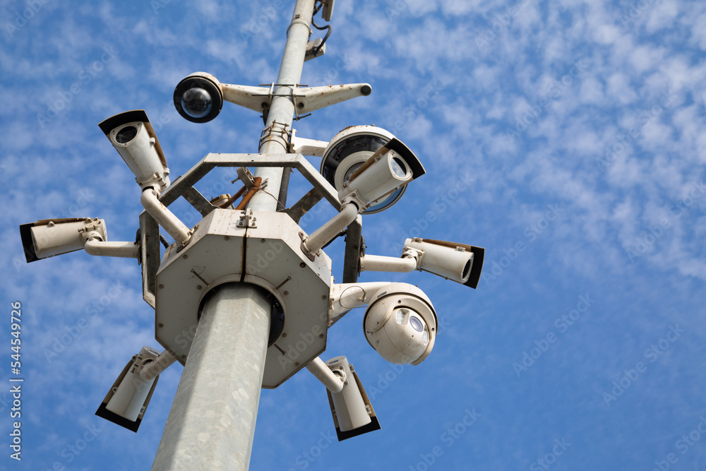City pole with surveillance cameras. Street cameras against the sky. City pole with surveillance cameras. Street cameras against the sky.