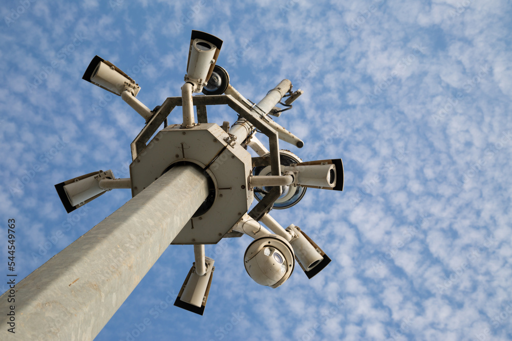 City pole with surveillance cameras. Street cameras against the sky. City pole with surveillance cameras. Street cameras against the sky.