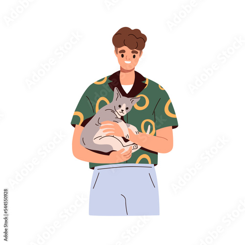 Man holding cute cat in hands. Happy pet owner with adorable funny kitty in a...