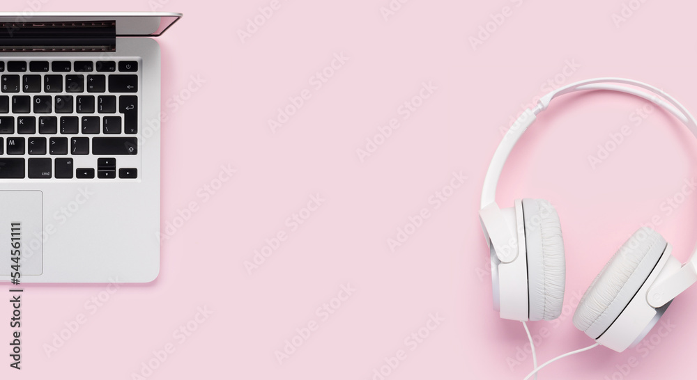 Headphones and laptop on pink Headphones and laptop on pink