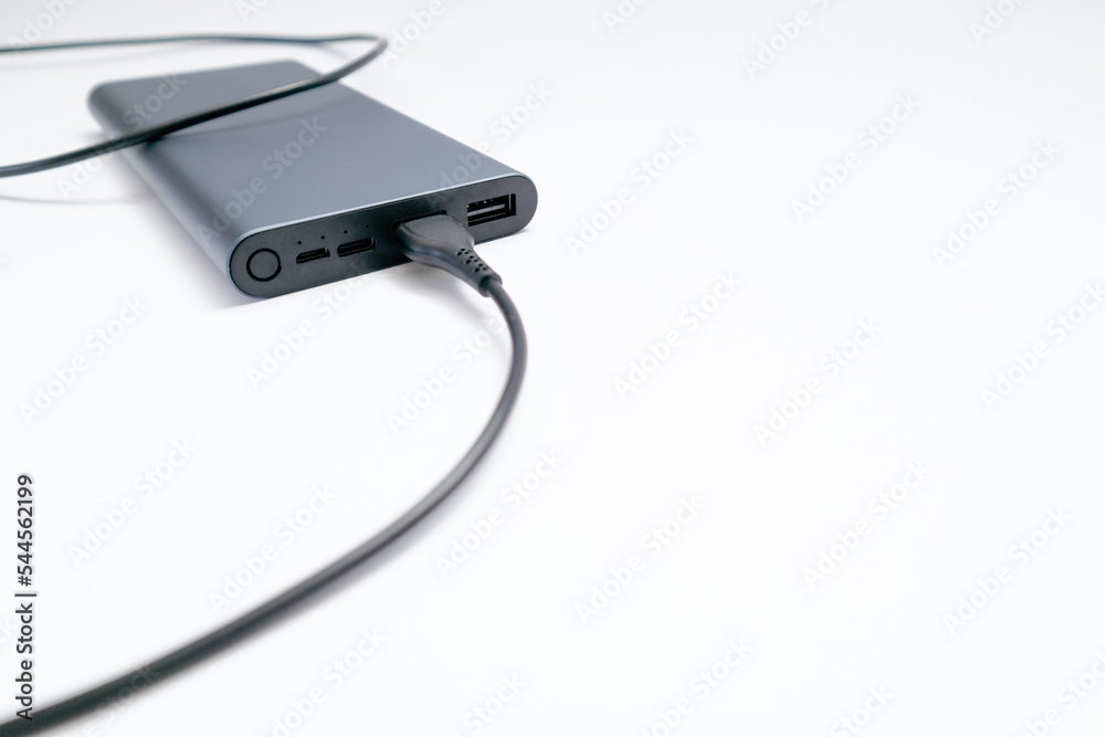 Power bank mockup isolated on white background. Gray metallic USB power bank for smartphones charging isolated on white background. Place for text. Power bank mockup isolated on white background. Gray metallic USB power bank for smartphones charging isolated on white background. Place for text.