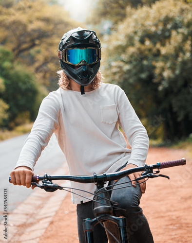 Mountain bike, helmet and fitness with a man athlete sitting on his bicycle while outdoor in nature for a ride Fototapet