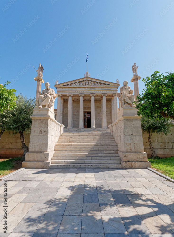 The national academy's main facade with Socrates, Plato, Athena and Apollo marble statues. Culture travel in Athens, Greece.