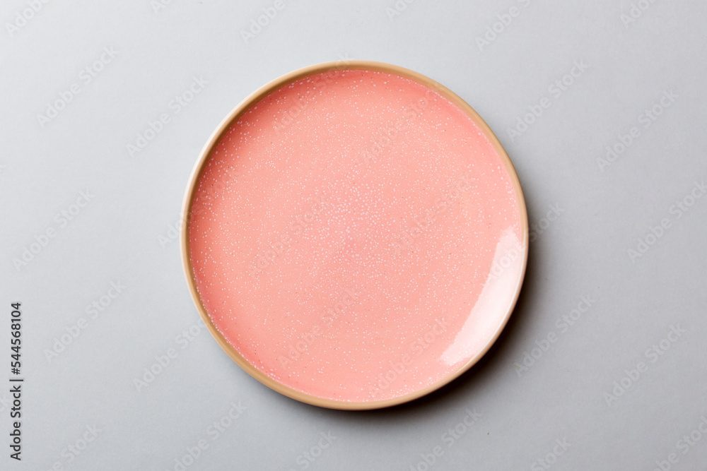 Top view of isolated of colored background empty round pink plate for food. Empty dish with space for your design Top view of isolated of colored background empty round pink plate for food. Empty dish with space for your design