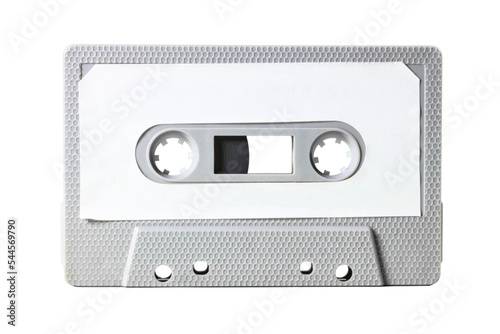 Isolated old vintage cassette tape from the 1980s (obsolete music technology). Grey hexagon grid plastic body, white empty label.
