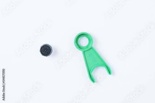 Faucet aerator and wrench installation. White background.