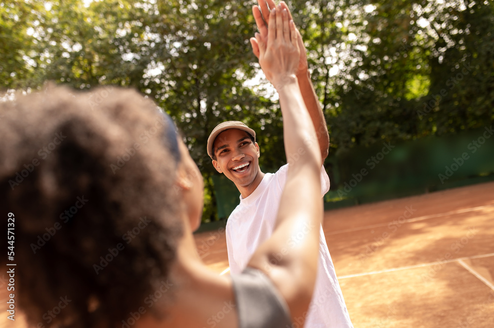 Young people feeling excited after a good tennis game