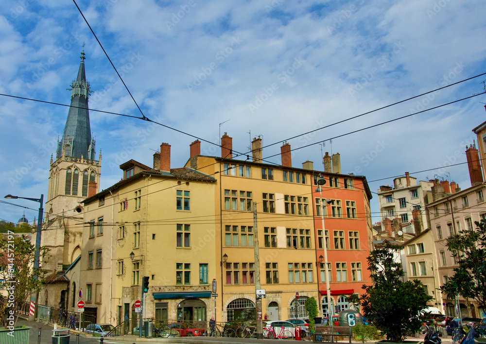 Very old colorful buildings of old Lyon, France, with the splendid church Saint Paul.