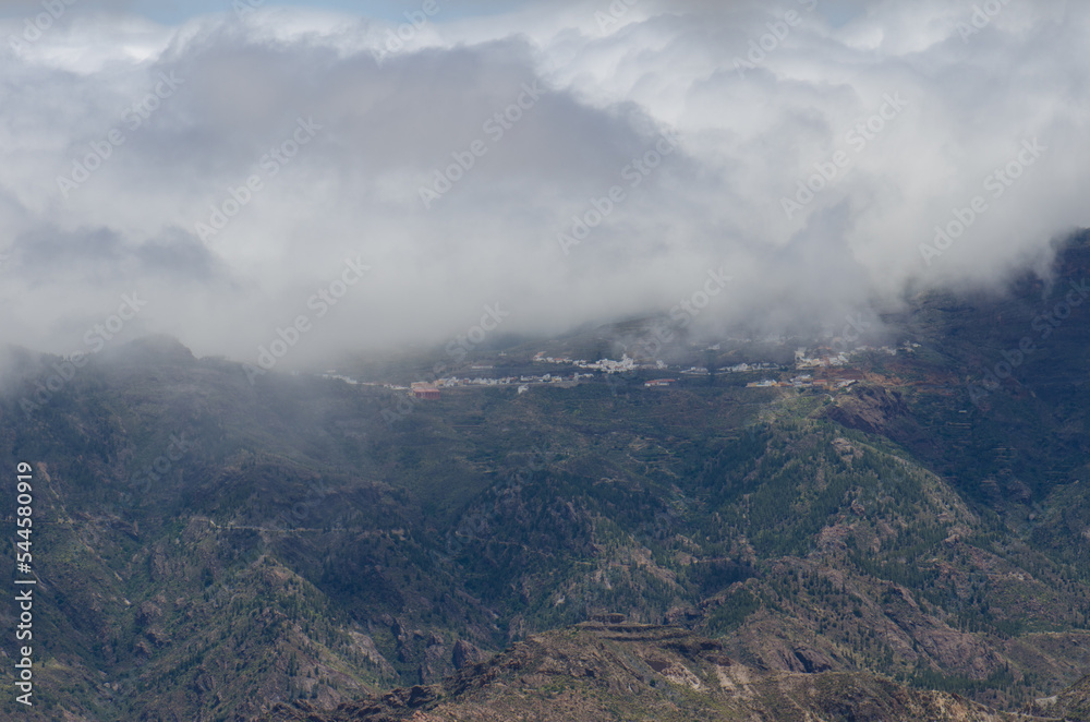 Village of Artenara in the fog. The Nublo Rural Park. Artenara. Gran Canaria. Canary Islands. Spain.