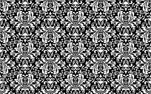 Wallpaper in the style of Baroque. Seamless vector background. White and black floral ornament. Graphic pattern for fabric, wallpaper, packaging. Ornate Damask flower ornament