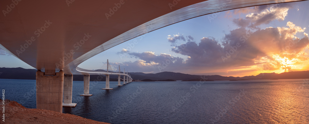 Peljesac Bridge, Croatia. Panoramic image of beautiful modern multi-span cable-stayed Peljesac Bridge over the sea in Dubrovnik-Neretva County, Croatia at sunset.