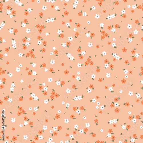 Cute floral pattern. Seamless vector texture. An elegant template for fashionable prints. Print with small white and orange flowers . peach   background.