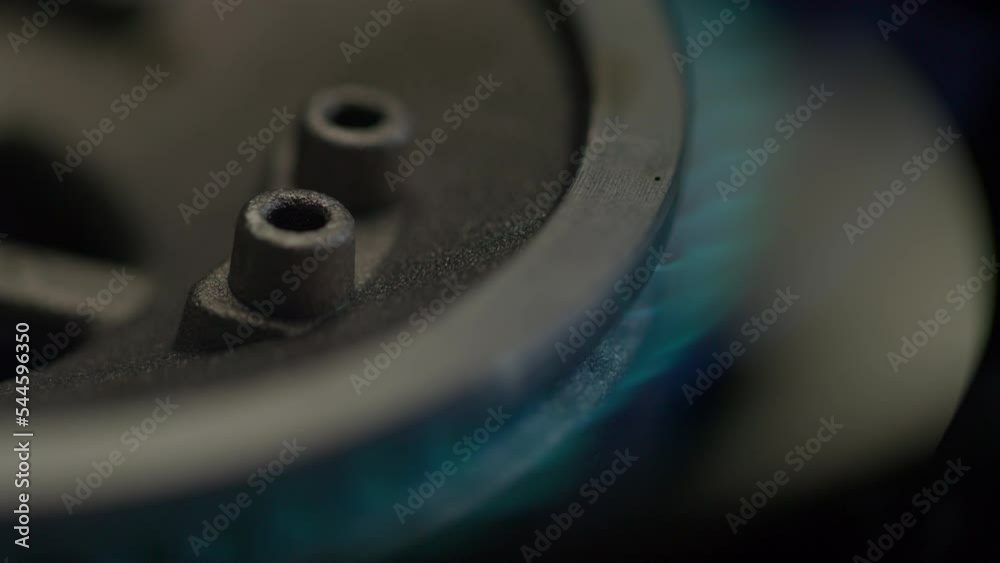 Gas stove burns with blue flam. Slow motion, close up. Gas stove burns with blue flam. Slow motion, close up.