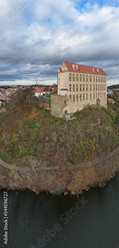 Aerial view of picturesque Czech town Plumlov with castle, Olomouc Region,reflected on the surface of Plumlov Lake, designed by Charles Eusebius of Liechtenstein. Tourist spot, Czech republic photo