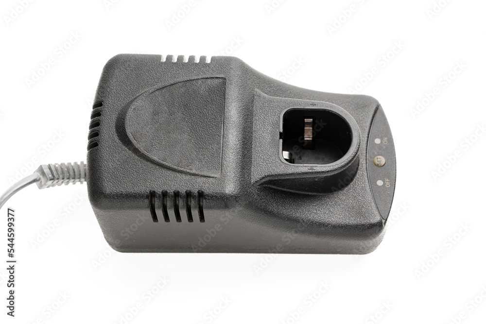 Charger for screwdriver on a white background. Accessory for energy replenishment, constant power supply of battery-powered models. Charger for screwdriver on a white background. Accessory for energy replenishment, constant power supply of battery-powered models.