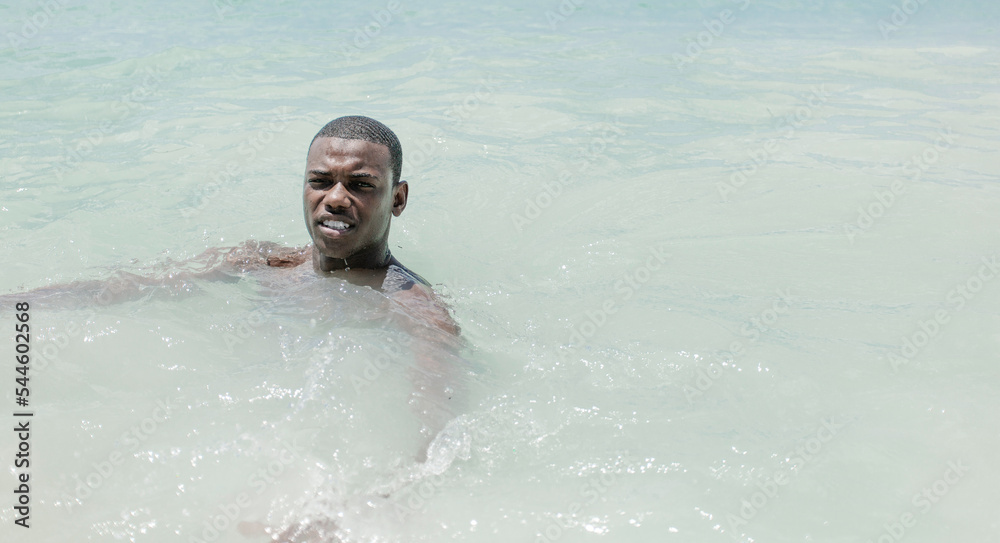 Smiling black man in the sea
