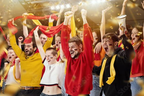 German emotive football soccer fans cheering their team, rejoice goal, supporting favourite players. Concept of sport, emotions, championship, competition.