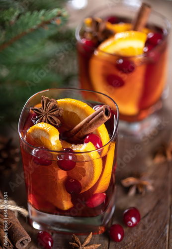 Mulled wine with orange slices, cranberries and spices