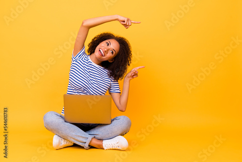Full length photo of cheerful nice person look direct fingers empty space blank isolated on yellow color background