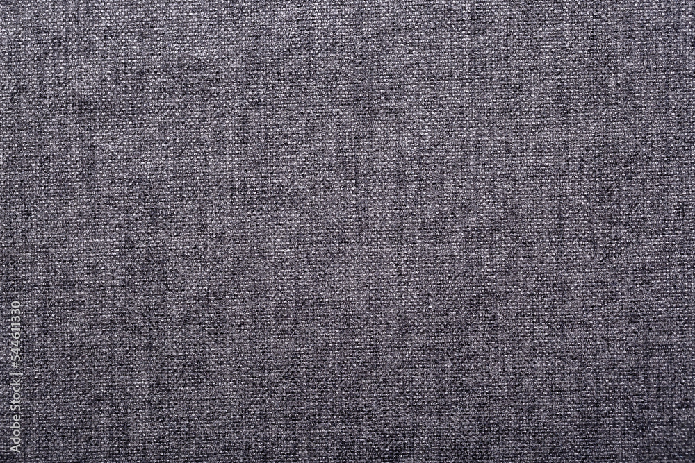 Close-up fabric swatches as a background. The texture of the material with patterns of weaving close-up. Upholstery fabric for interior decoration.