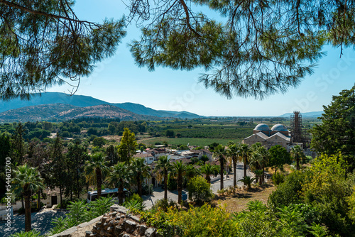 View of Isa Bey Mosque and its surroundings with lots of trees.  It is situated on the outskirts of the Ayasuluk Hills at Selçuk, İzmir. photo