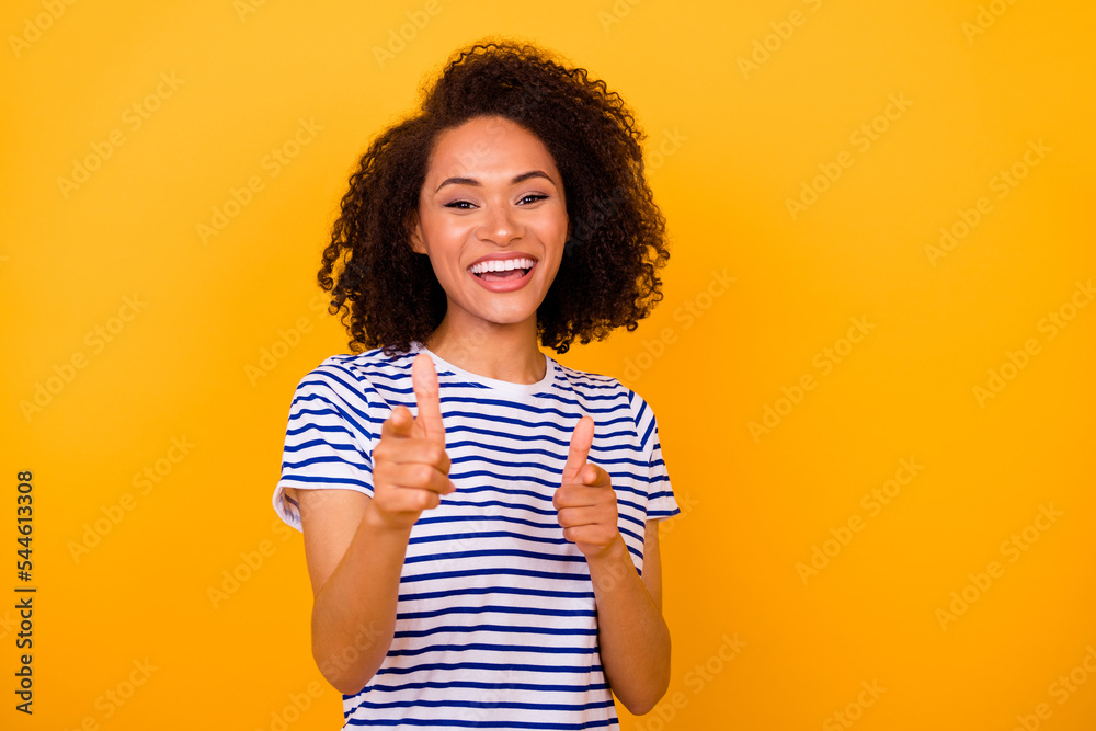 Photo of pretty excited lady wear white t-shirt pointing fingers you empty space isolated yellow color background