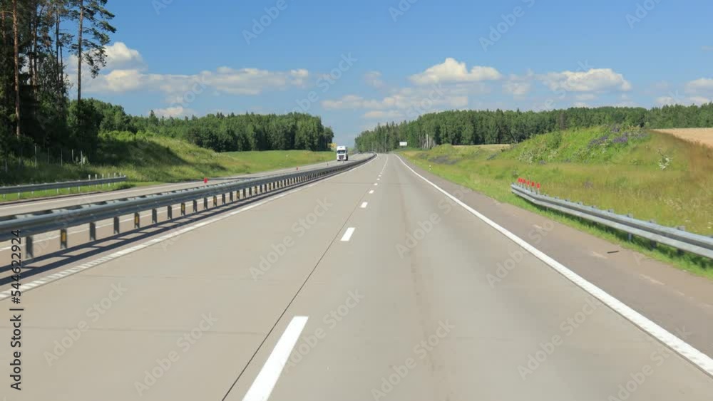 Highway wide road, transport and blue sky with clouds on a summer day Highway wide road, transport and blue sky with clouds on a summer day