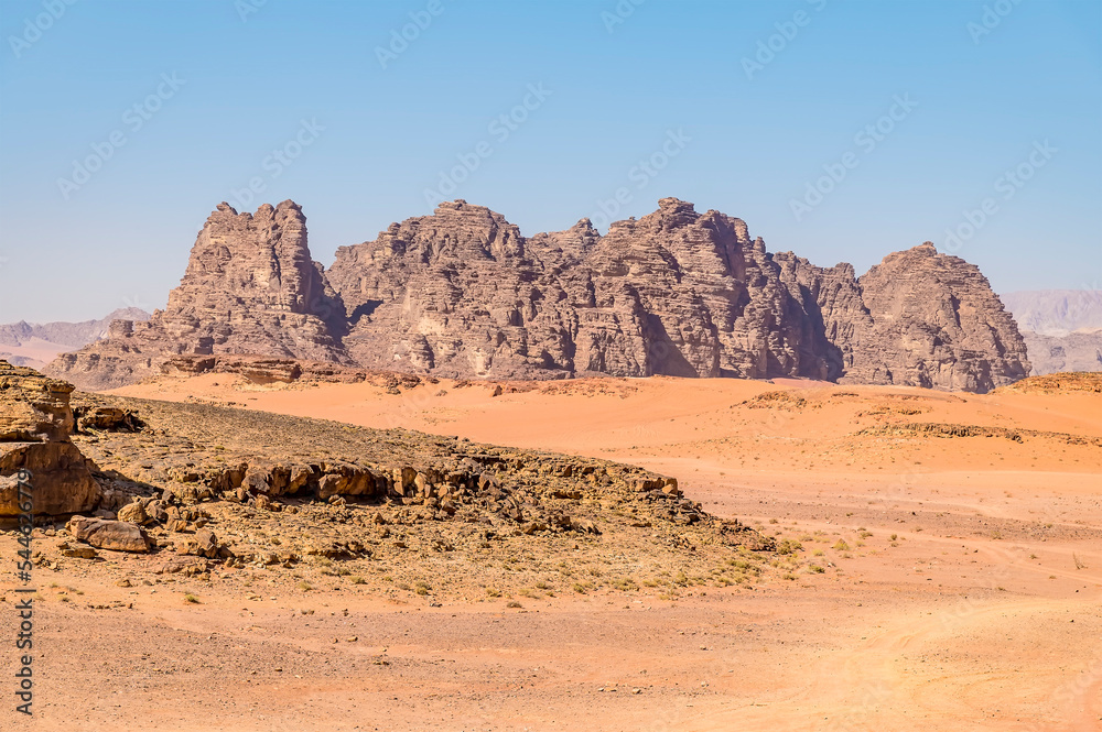 A view of rocky outcrops in the desert landscape in Wadi Rum, Jordan in summertime