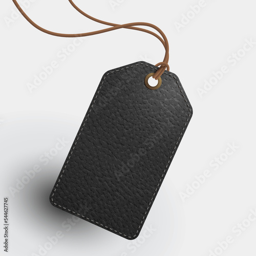 Blank black leather rectangle tag with brown leather strap. Realistic EPS file.