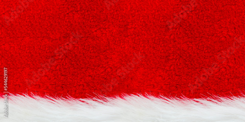 Red velvet and white fur background. Santa Claus hat texture.