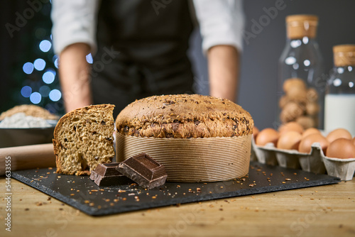 Panettone with cereals to celebrate Christmas and Holiday. Traditional Italian homemade Christmas panettone typical of Milan with flour, eggs, cereals, oats, spelled, barley and chocolate. 
