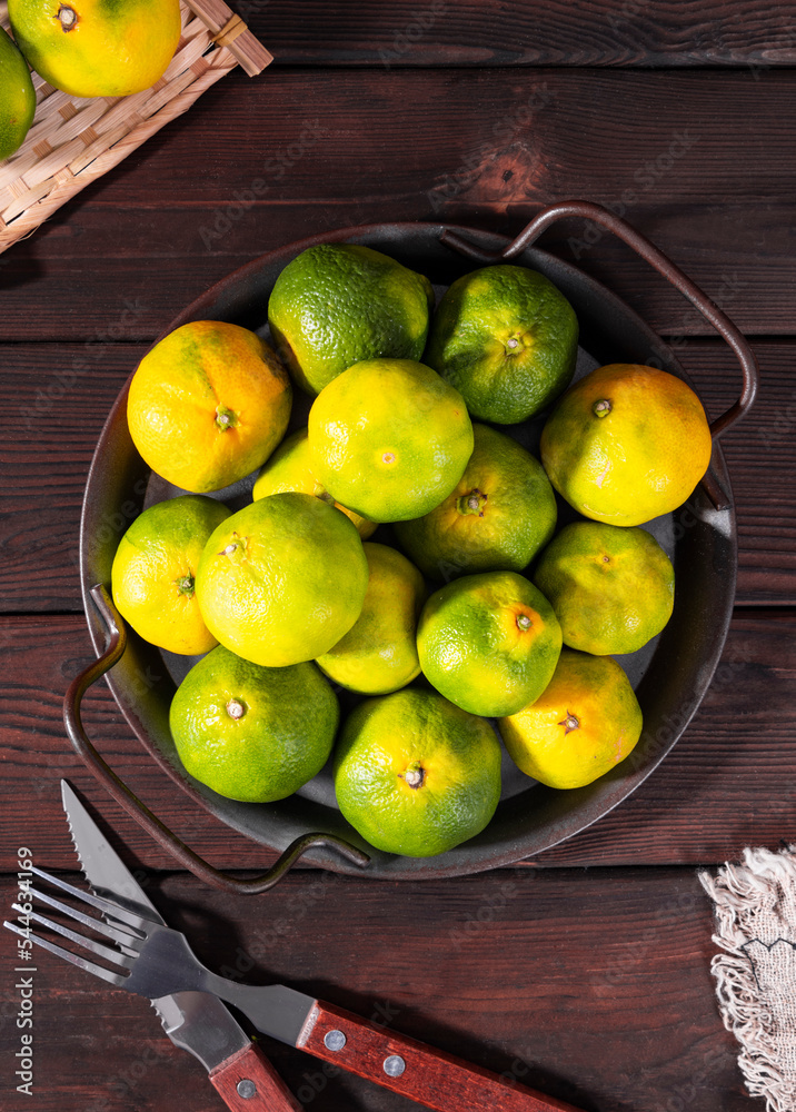 Green orange, a fresh fruit rich in vitamins Green orange, a fresh fruit rich in vitamins