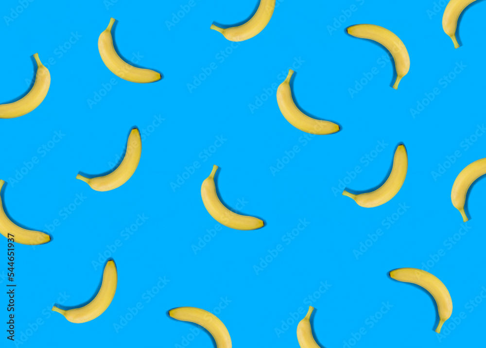 Banana on the blue background. Flat lay. Pattern. Top view. Banana on the blue background. Flat lay. Pattern. Top view.