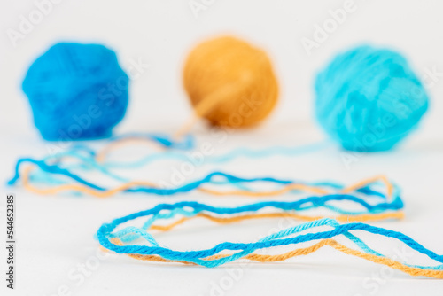 Colorful woolen balls on white background