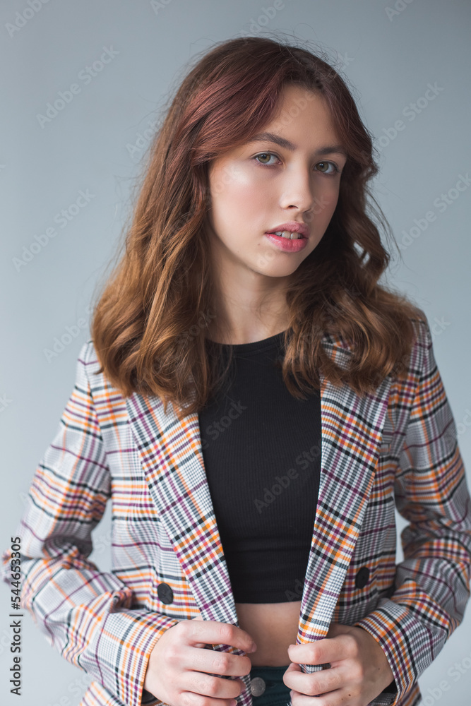 Beautiful gorgeous young girl in suit. Close up brunette woman portrait Beautiful gorgeous young girl in suit. Close up brunette woman portrait